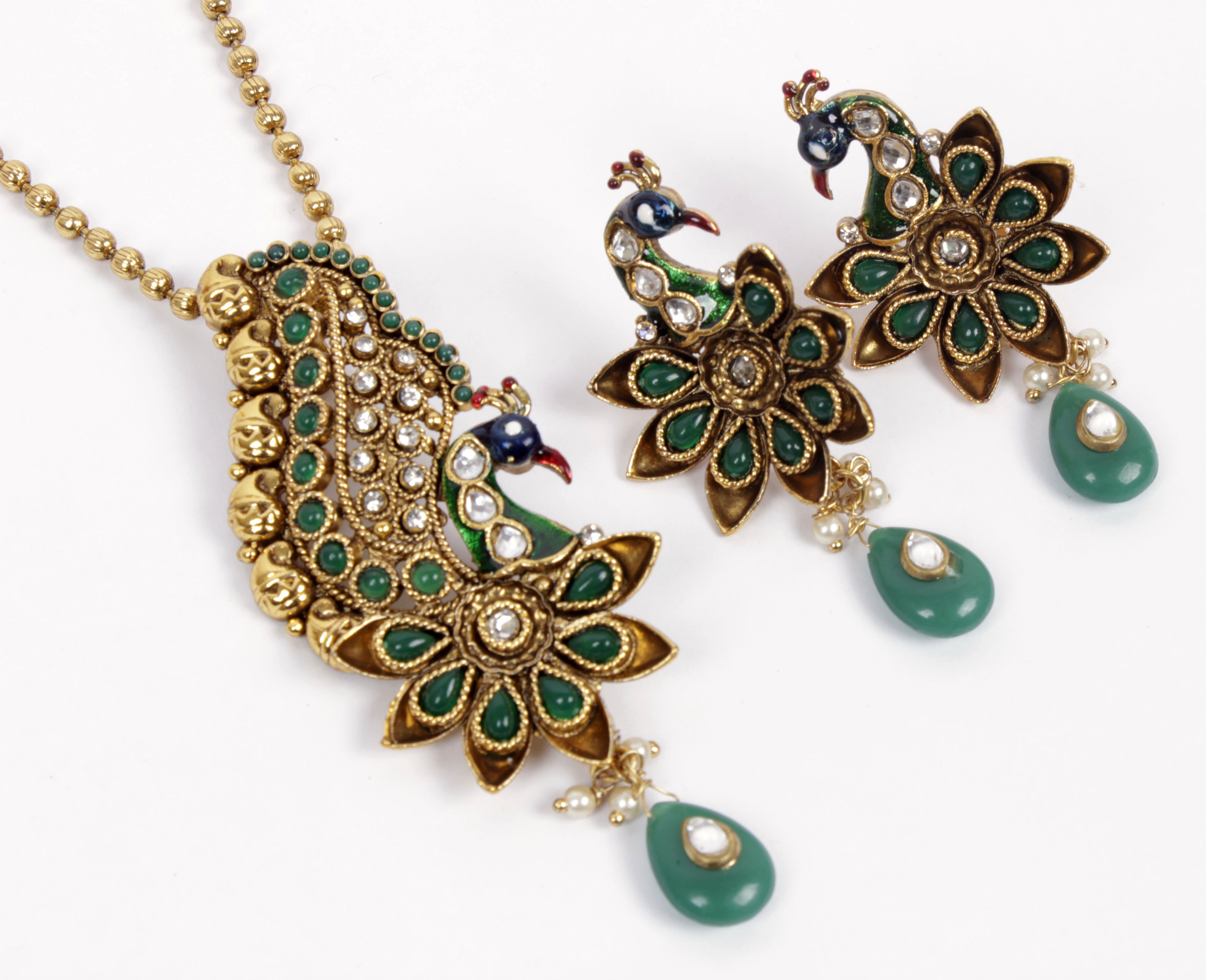 http://s6.picofile.com/file/8198252200/Craftsvilla_Gold_Plated_Antique_Pendant_Set_With_Traditional_Peacock_Design_Stone_Work_B33_30184834_d0f16847_a7e6_42e2_8d98_816b4000bfb5_jpg.jpg